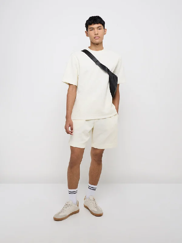 Men's side - stripe track shorts for a sporty running lookStudiofit Off-White Knitted Relaxed-Fit Mid-Rise Shorts