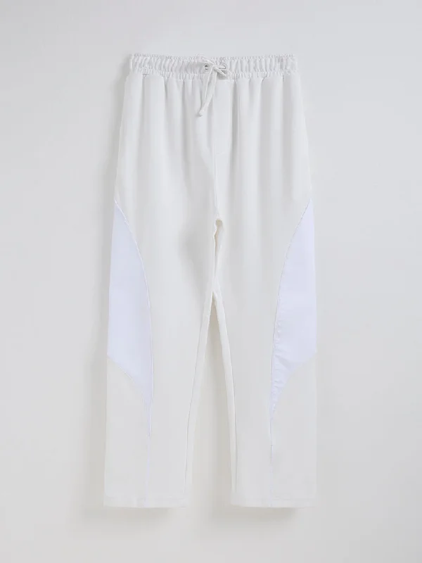 Men's distressed cotton shorts for a bohemian - inspired styleStudiofit Off-White Relaxed-Fit Mid-Rise Track Pants